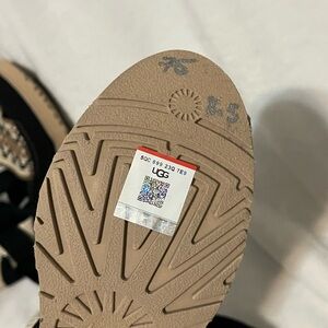 UGG Black and Tan Heels with Textured Sole